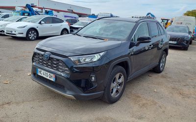 the toyota rav is parked in a parking lot with other cars
