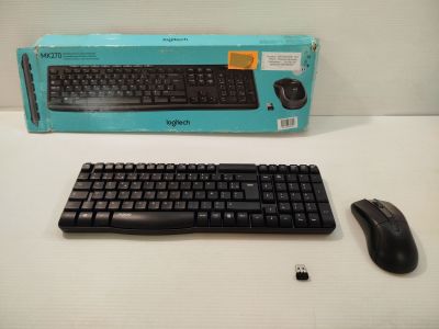 a computer keyboard and a mouse on a table