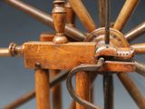 a close up of a spinning wheel on a table