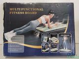 a box with a picture of a woman doing an exercise on a board