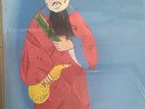 painting of a man in a red robe holding a fan in his hand