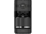 a black coffee maker sitting on top of a white surface