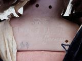 a close up of a woman ' s neck with a tattoo on it