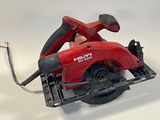 a picture of a corded circular saw on a white surface
