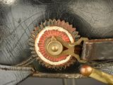 a close up of a leather hat with a metal buckle