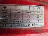 a close up of a label on the side of a red vehicle