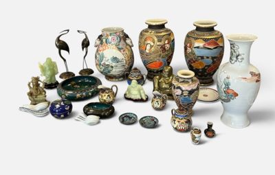 many different vases and figurines sitting on a white surface
