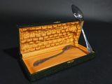 a spoon and spoon in a box with a spoon in it