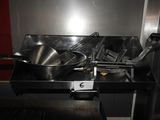 a picture of a kitchen with a lot of pots and pans on it