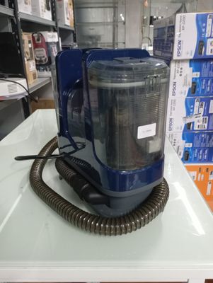 a blue machine that is sitting on top of a table