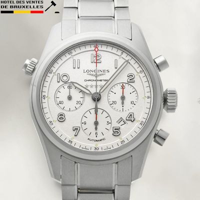 a silver watch with a white face and a red second hand