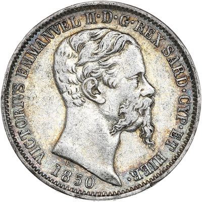 une pièce d'argent représentant le visage d'un homme barbu