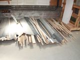 several pieces of wood are stacked on the floor in a garage