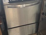 a dishwasher that is in the middle of a kitchen