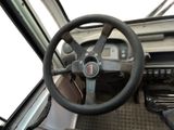a steering wheel and dashboard of a truck