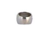sterling silver ring with black diamonds on a white background