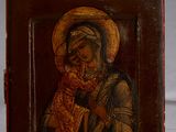 painting of a woman holding a child in her arms