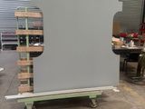 a large screen in the middle of a warehouse