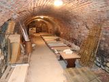 a long tunnel that has many tables and chairs in it