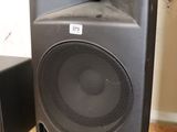two speakers that are sitting on the floor