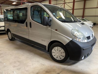 a silver van that is parked in a garage