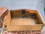 a small wooden table with a drawer on it