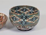 two bowls sitting next to each other on a table