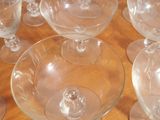 a lot of empty wine glasses sitting on a table