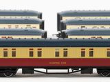 three trains that are sitting side by side on the tracks