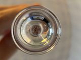 a person holding a glass of water in their hand