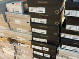 boxes stacked on top of each other on the floor in a store