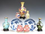 many different vases and bowls sitting on a table