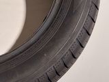a close up of a tire on a white surface