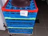 a stack of plastic crates with a bowl on top of it