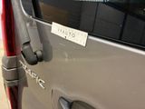 a close up of a car door handle with a sticker on it