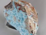 a large piece of rock that is on top of a blue object