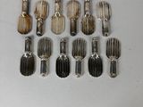 a lot of silver spoons and spoons on a table