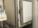 a machine that is sitting in a kitchen next to a bowl