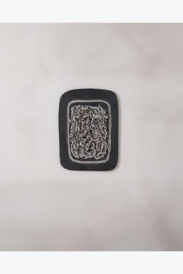 une image représentant un carré noir et blanc orné d'un motif