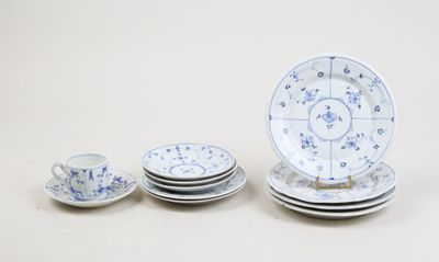 a group of plates and cups sitting on a table