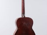 a close up of a guitar hanging from a string