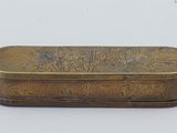 an old brass box with a floral design on it