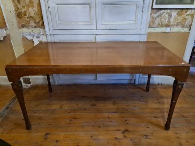 a wooden table that is sitting on a hard wood floor