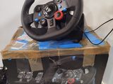 the steering wheel is sitting on top of the box on the table