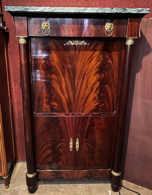 a cabinet that has a marble top on top of it