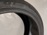 a close up of a tire on a white surface
