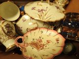 many different types of porcelain dishes and vases on the table
