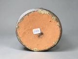an image of a vase with a tag on it