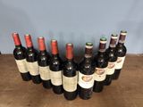 several bottles of wine are lined up in a row on a table