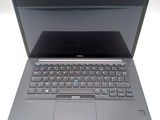 a dell laptop computer with a blue keyboard on it